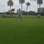 A golfer taking a swing
