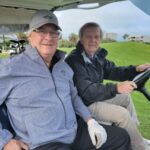 Two golfers in their cart