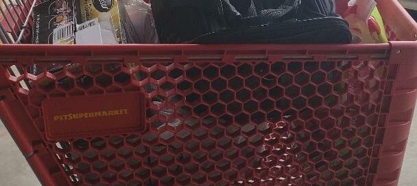 A shopping cart full of donations from Pet Supermarket.