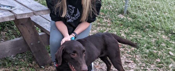 Hunter posing for his adoption picture with adopter, Sami.