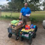 Jason delivering the 2 cart loads of donations to Satchels.