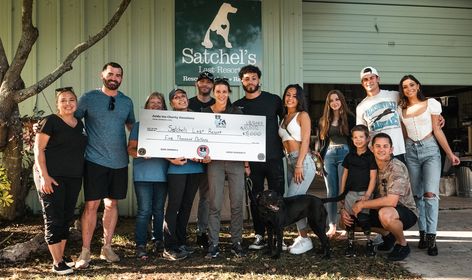 Group photo of Satchel's staff and Zelda organization respresentatives presenting the $10000 check.