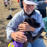 Rey giving Bill a hug at an off-site adoption event.