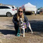 Roscoe posing with volunteer, Jill, at the market.