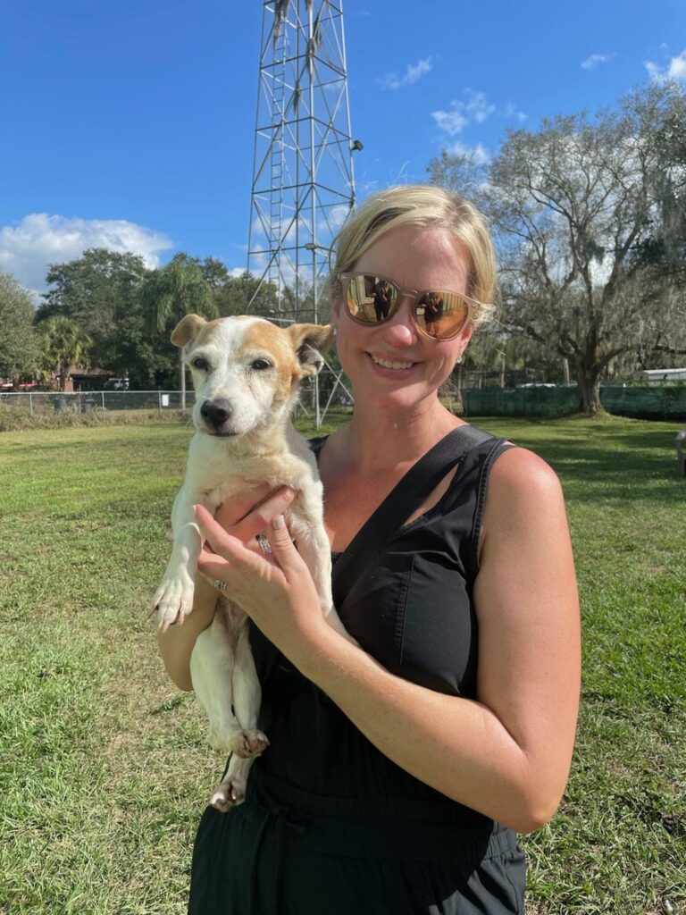 Triscuit in the arms of her adopter, Katie.