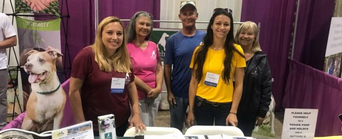 Satchel's volunteers - Jill, Maria, Doug, Michal Anne (staff) and Jacky behind the Satchel's table at the event.