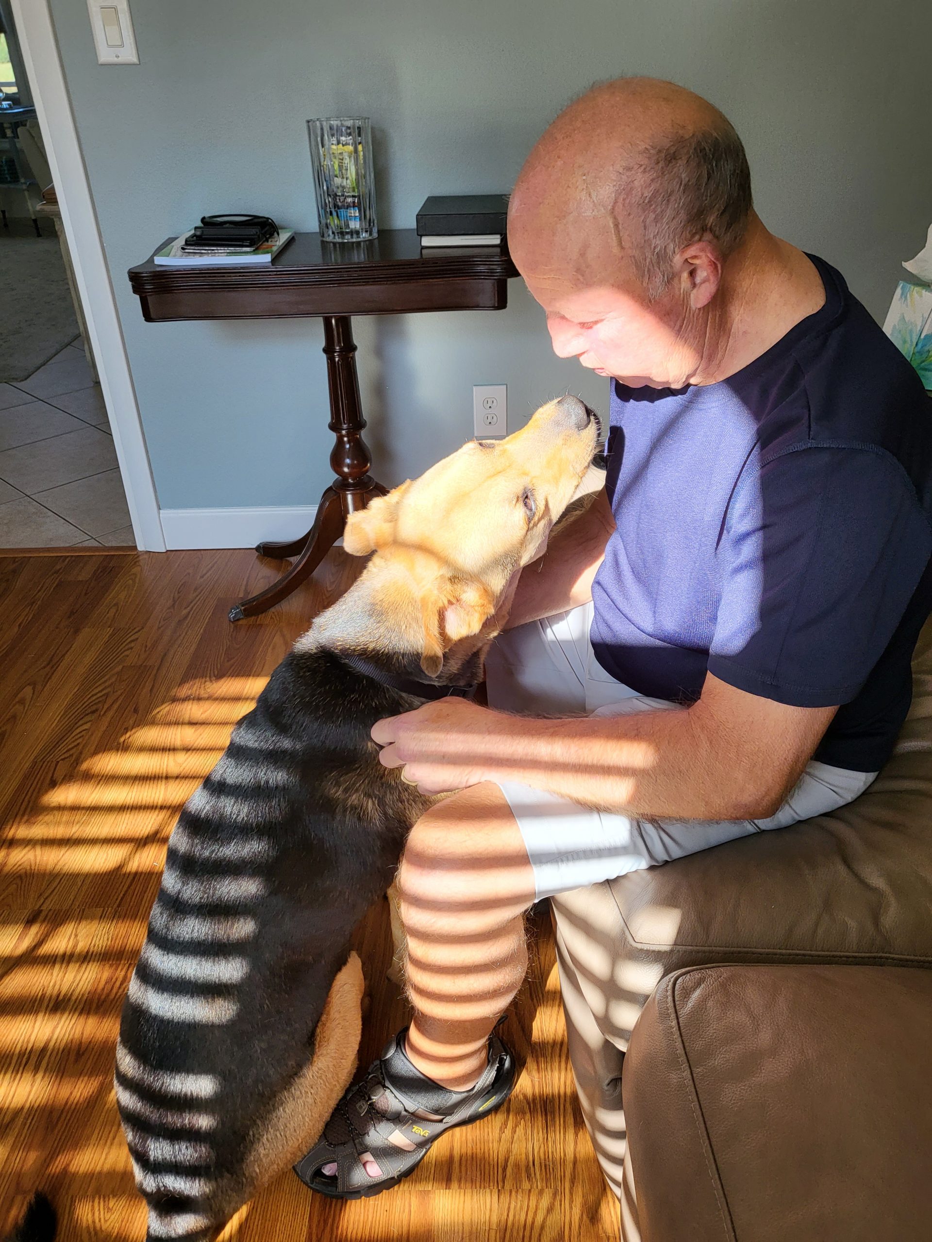 Chipper smiling up at dad, going in for the kiss.