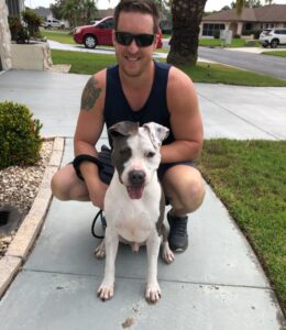 Harley sitting nicely posing with his new dad.