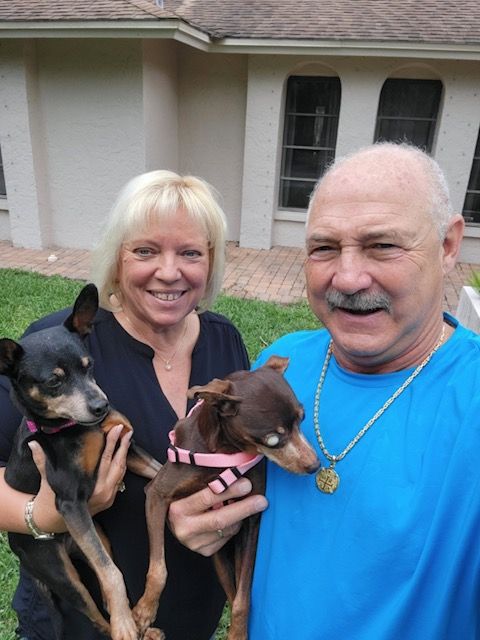 Figgy with his new mom and dad and sister Molly.