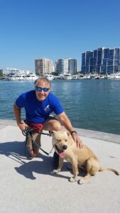 Lorenzo sitting by the bay with Dale.