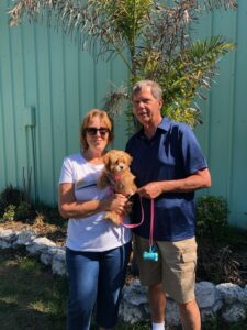 Lulu in the arms of her new mom and dad.