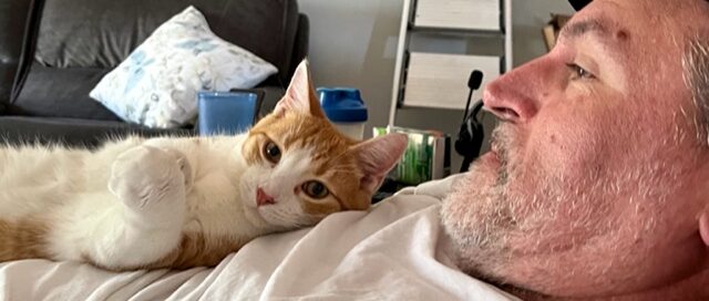 Tigger snuggling with his dad.