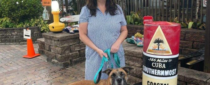 Joey standing outside a restaurant with his new mom.