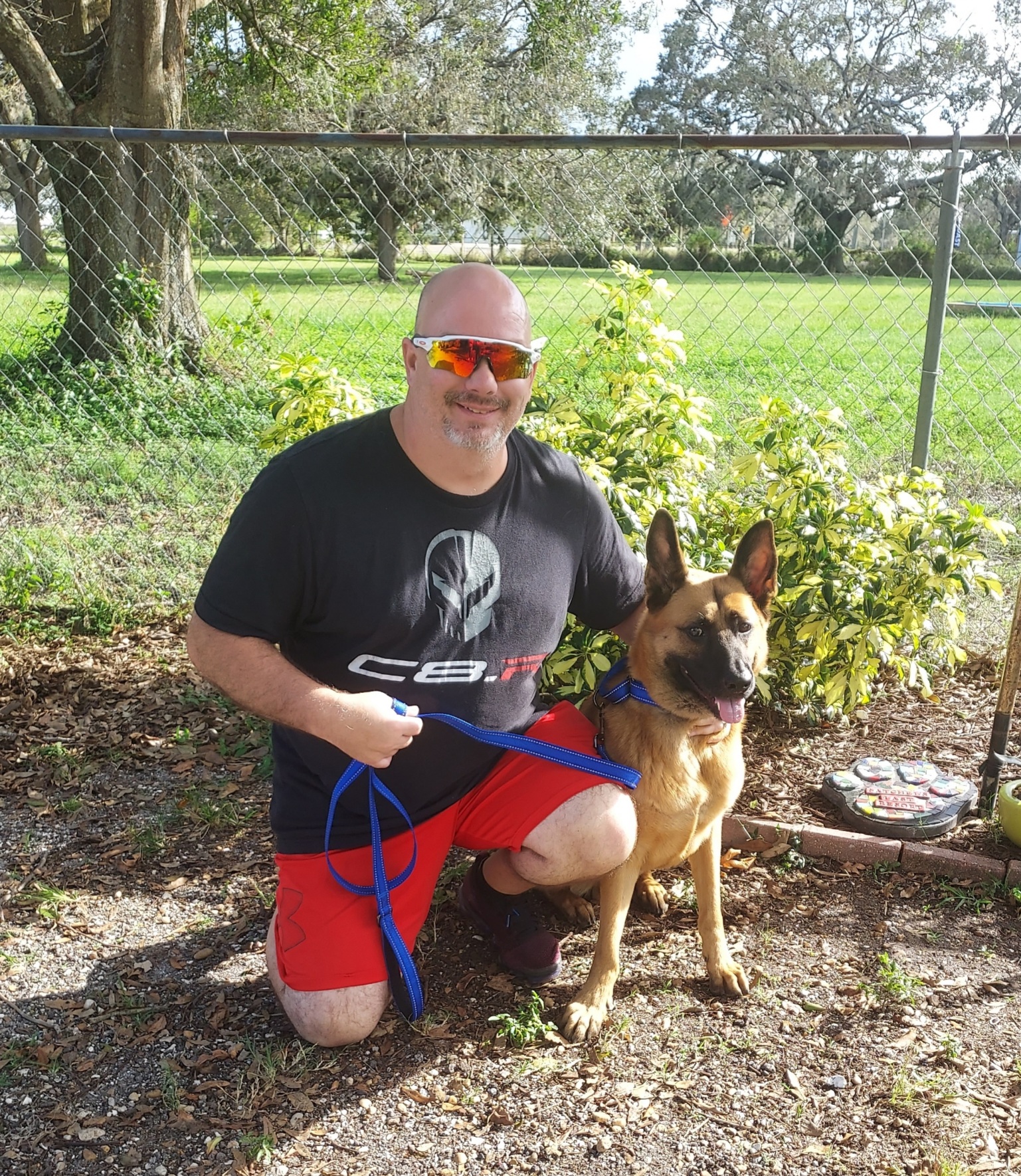 Ace sitting beside his new dad.