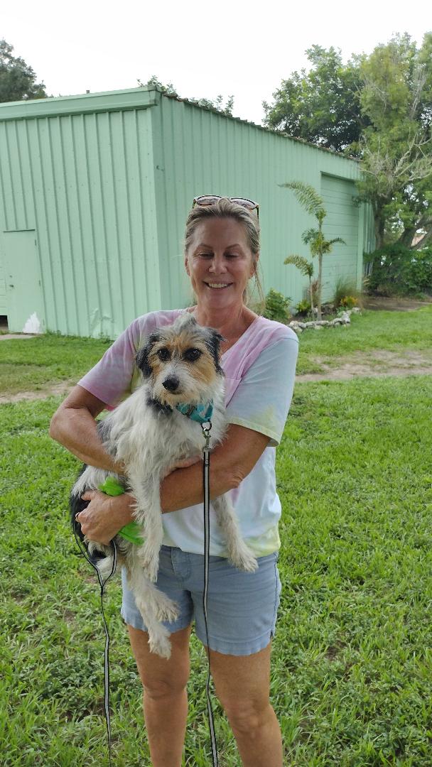 Jacklyn being held by her new mom.