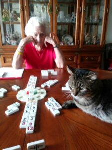 O'Malley playing dominoes with his mom.