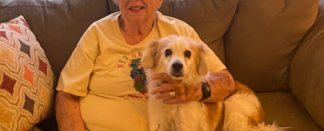 Rusty sitting on the couch with his mom.