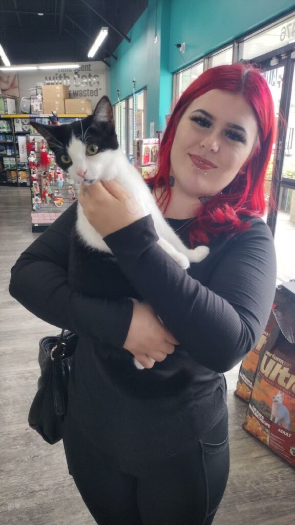 Ember in the arms of her new mom.