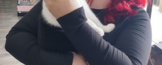 Ember in the arms of her new mom.