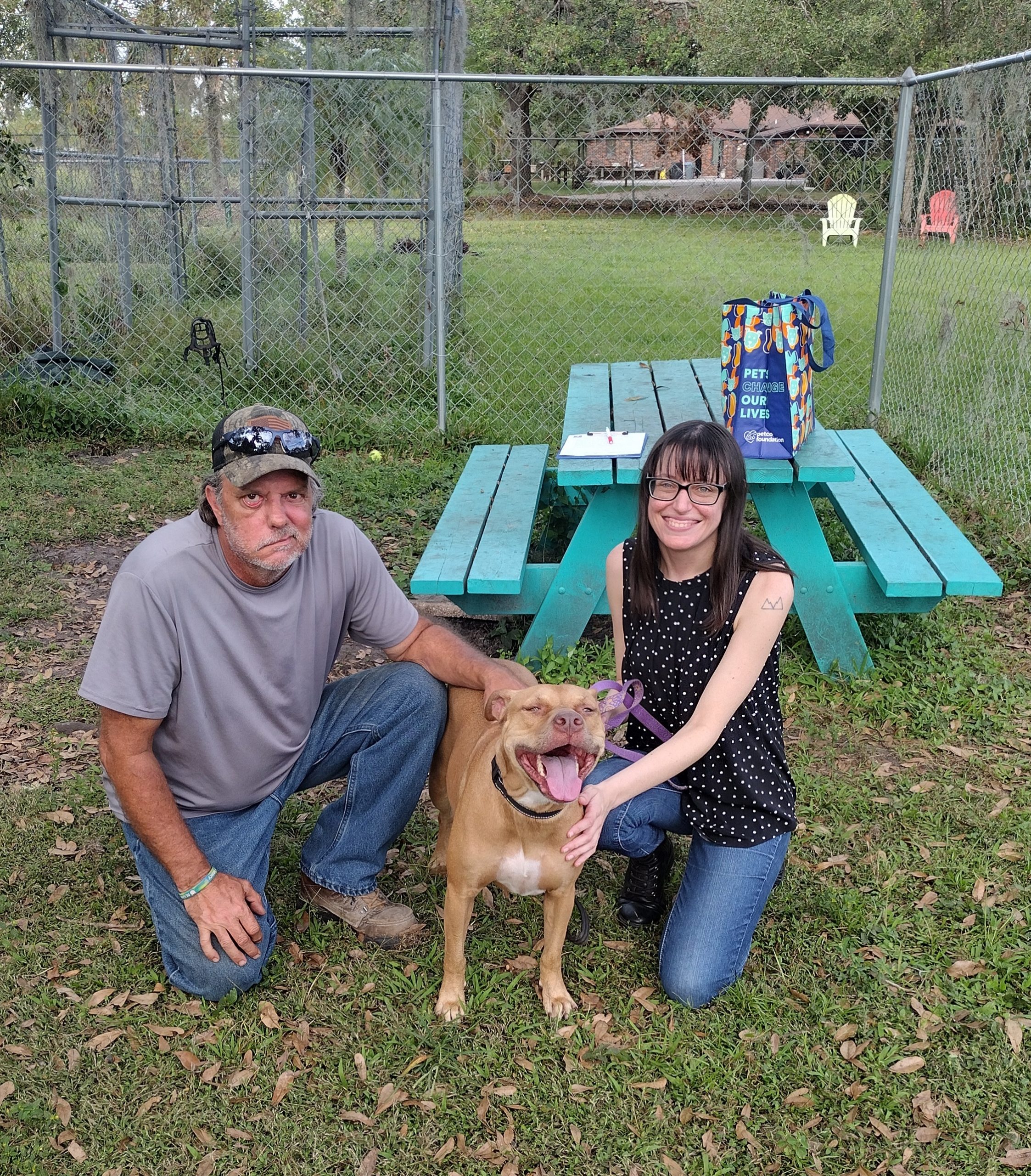 Hope standing in between mom and dad squatted beside.