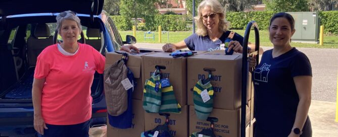 Getting ready to load the vehicle with boxes of donations.