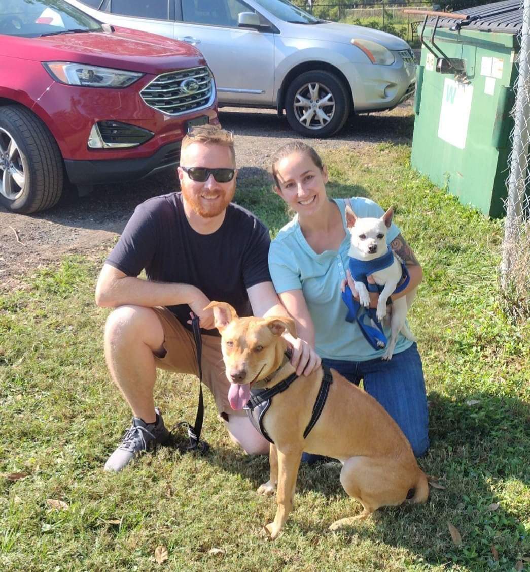 Coppertop sitting with his new mom and dad leaving Satchel's.