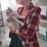 Macy in Satchel's cat room in mom's arms.