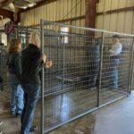 A new kennel being assembled by volunteers.