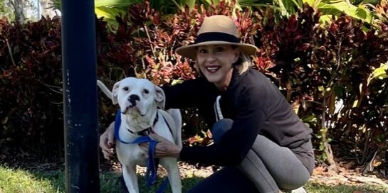 Millie with her new mom outside their home.