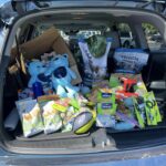 Petco donations in the back of our volunteer vehicle.