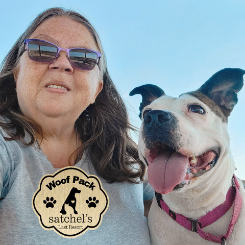 Turtle sitting beside her Woof Pack leader Mary. Facial view.