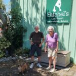 Lady Bug standing outside Satchel's with her new mom and dad.