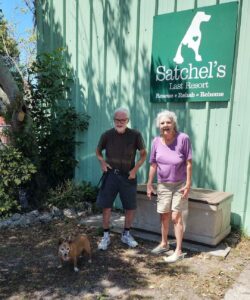 Lady Bug standing outside Satchel's with her new mom and dad.
