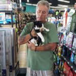 Ralphie in the arms of his new dad at Pet Superemarket.