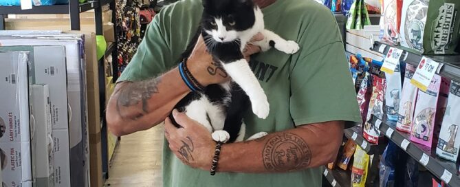 Ralphie in the arms of his new dad at Pet Superemarket.