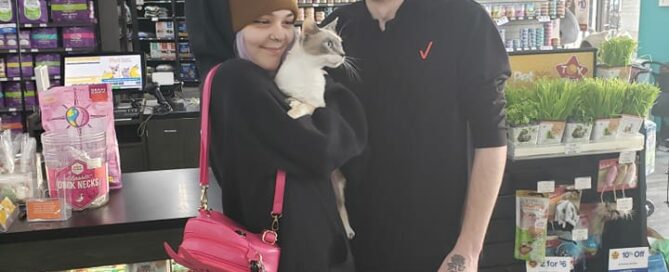 Enola in the arms of his new family.