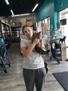Isaac in the arms of his new mom at Pet Supermarket.