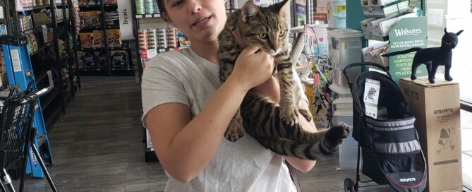 Isaac in the arms of his new mom at Pet Supermarket.